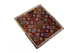 Corner detail of 2000s Shiraz rug showing border pattern and Wool pile