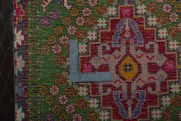 Backside of handmade 2000s Shiraz rug showing knot structure and weave density