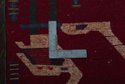 Backside of handmade 2000s Shiraz rug showing knot structure and weave density