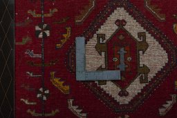 Backside of handmade 2000s Shiraz rug showing knot structure and weave density