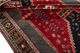 Corner detail of 2000s Shiraz rug showing border pattern and Wool pile