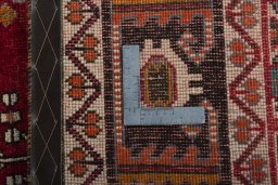 Surface texture of 2000s Shiraz rug with natural Wool and intricate pattern
