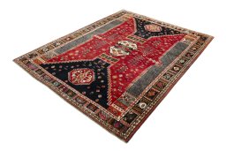 Corner detail of 2000s Shiraz rug showing border pattern and Wool pile