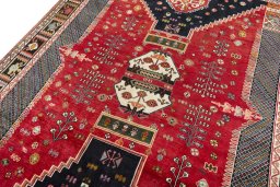 Backside of handmade 2000s Shiraz rug showing knot structure and weave density