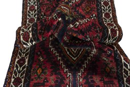 Corner detail of 2000s Shiraz rug showing border pattern and Wool pile