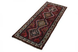 Corner detail of 2000s Shiraz rug showing border pattern and Wool pile