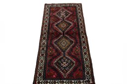 Surface texture of 2000s Shiraz rug with natural Wool and intricate pattern