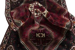 Corner detail of 2000s Shiraz rug showing border pattern and Wool pile