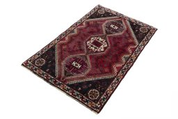 Corner detail of 2000s Shiraz rug showing border pattern and Wool pile