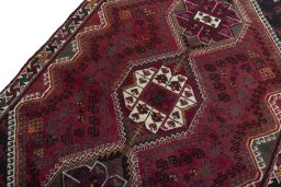 Backside of handmade 2000s Shiraz rug showing knot structure and weave density