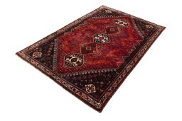 Corner detail of 2000s Shiraz rug showing border pattern and Wool pile
