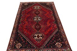 Surface texture of 2000s Shiraz rug with natural Wool and intricate pattern
