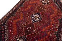 Backside of handmade 2000s Shiraz rug showing knot structure and weave density