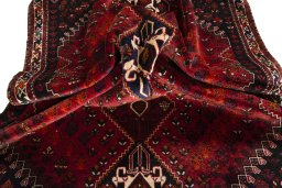 Full view of 2000s Shiraz rug from Iran / Persia, 276 × 180 cm in Red tones