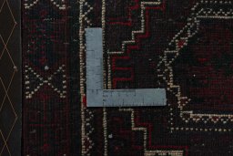 Backside of handmade 2000s Shiraz rug showing knot structure and weave density