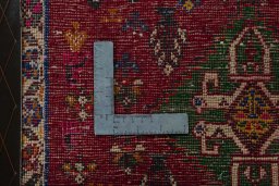 Backside of handmade 2000s Shiraz rug showing knot structure and weave density