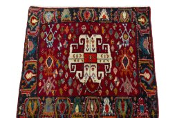 Surface texture of 2000s Shiraz rug with natural Wool and intricate pattern