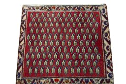 Surface texture of 2000s Shiraz rug with natural Wool and intricate pattern