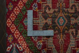 Backside of handmade 2000s Shiraz rug showing knot structure and weave density
