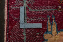Backside of handmade 2000s Shiraz rug showing knot structure and weave density