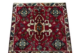 Surface texture of 2000s Shiraz rug with natural Wool and intricate pattern