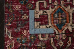 Backside of handmade 2000s Shiraz rug showing knot structure and weave density