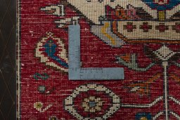 Backside of handmade 2000s Shiraz rug showing knot structure and weave density