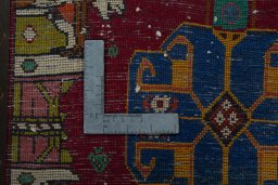 Backside of handmade 2000s Shiraz rug showing knot structure and weave density