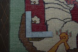 Backside of handmade 2000s Shiraz rug showing knot structure and weave density