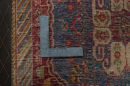 Backside of handmade 2000s Shiraz rug showing knot structure and weave density