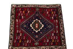 Surface texture of 2000s Shiraz rug with natural Wool and intricate pattern