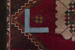 Backside of handmade 2000s Shiraz rug showing knot structure and weave density