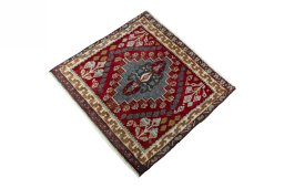 Corner detail of 2000s Shiraz rug showing border pattern and Wool pile