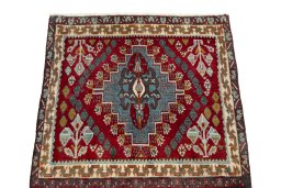 Surface texture of 2000s Shiraz rug with natural Wool and intricate pattern