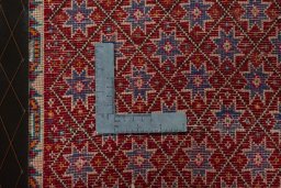 Backside of handmade 2000s Shiraz rug showing knot structure and weave density