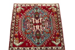 Surface texture of 2000s Shiraz rug with natural Wool and intricate pattern