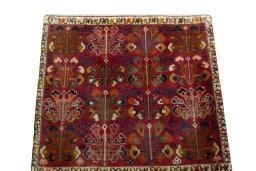 Surface texture of 2000s Shiraz rug with natural Wool and intricate pattern