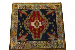 Surface texture of 2000s Shiraz rug with natural Wool and intricate pattern