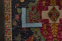 Backside of handmade 2000s Shiraz rug showing knot structure and weave density