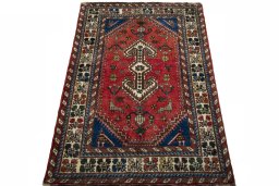 Surface texture of 2000s Shiraz rug with natural Wool and intricate pattern