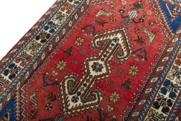 Backside of handmade 2000s Shiraz rug showing knot structure and weave density