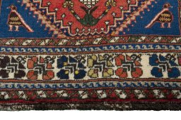 Close-up detail of 2000s Shiraz rug from Iran / Persia showing Wool weave