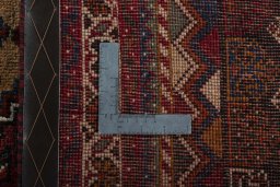Surface texture of 2000s Shiraz rug with natural Wool and intricate pattern
