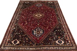 Surface texture of 2000s Shiraz rug with natural Wool and intricate pattern