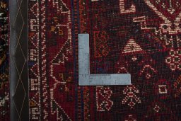 Surface texture of 2000s Shiraz rug with natural Wool and intricate pattern