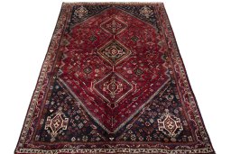 Surface texture of 2000s Shiraz rug with natural Wool and intricate pattern