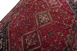 Backside of handmade 2000s Shiraz rug showing knot structure and weave density