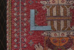 Backside of handmade 2000s Shiraz rug showing knot structure and weave density