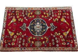 Surface texture of 2000s Shiraz rug with natural Wool and intricate pattern