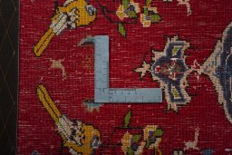Backside of handmade 2000s Shiraz rug showing knot structure and weave density
